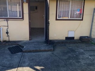 View profile: Flat is located at the back of this house.